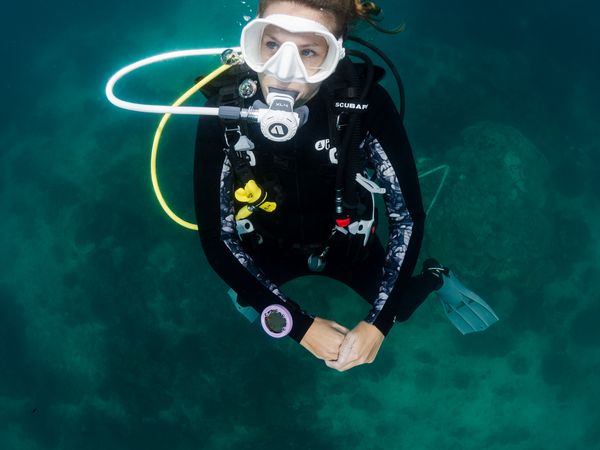 Commercial underwater photography featuring dive equipment and professional underwater scenes
