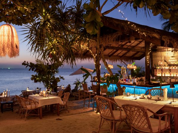 Sunset dining at beachfront restaurant