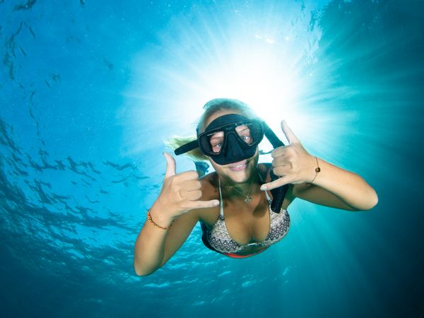 Happy tourists snorkeling in Koh Lanta waters